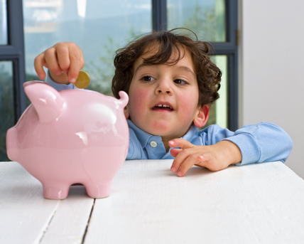 child and piggy bank