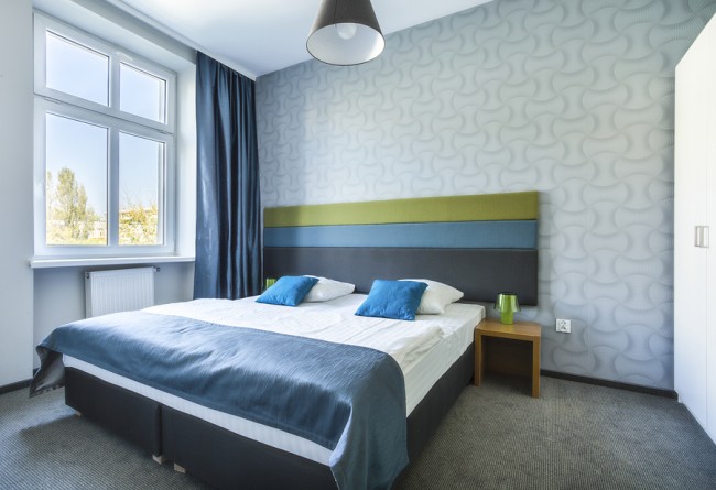 Big Twin Bed In Blue Hotel Apartment